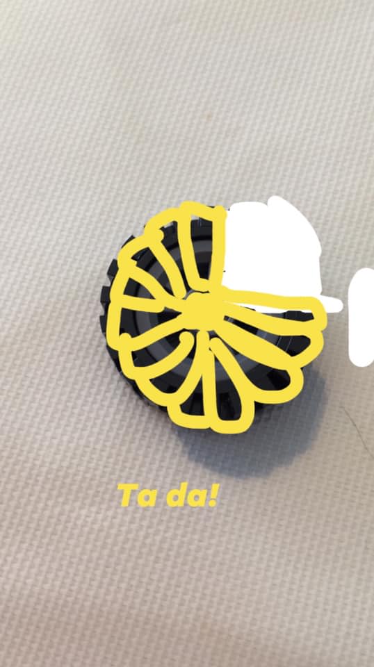 LEGO wheel with ammonite shell drawn on top