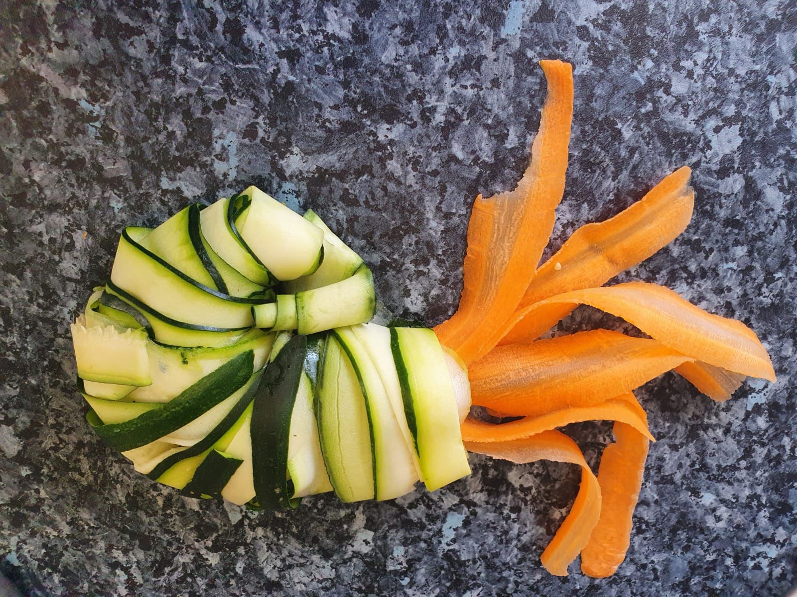 Ammonite created using cucumber and carrot shavings